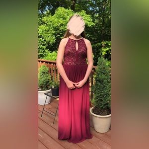 Burgundy sequin keyhole sleeveless formal dress.